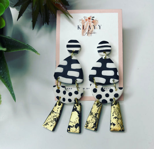 Black and white spot polymer clay earrings with gold dangles